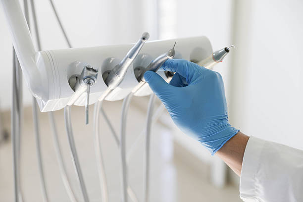 Professional Tooth Extraction technician working in West Sayville, NY